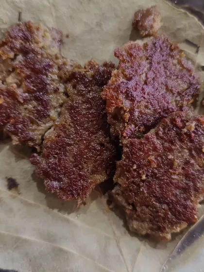 Galouti kebabs served the traditional way on a leaf. These are another melt-in-your-mouth specialty from Lucknow.