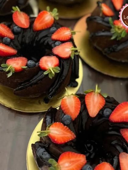 My chocolate bundt cakes topped with fresh strawberries and blueberries. They are perfect for smaller gatherings or as a simple, elegant dessert.