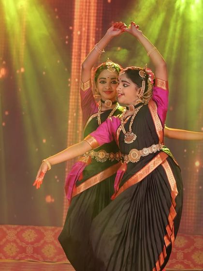 A beautiful synchronized pose by two of our students. Their connection and coordination are key elements of a successful duet performance.