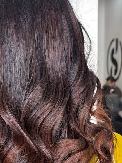 A close-up of the glossy chocolate tones, showing the rich color and texture.