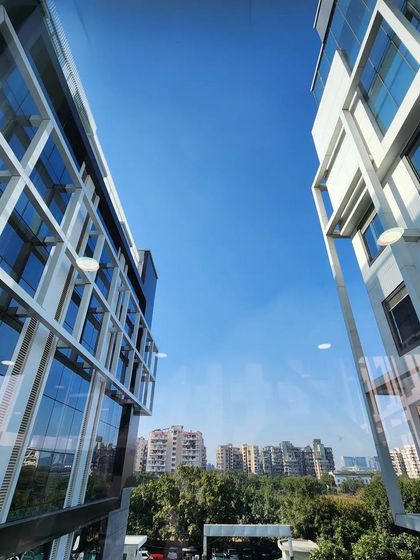 A view from the skybridge at Venkateshwar Hospital, looking out at the two connecting buildings. The design ensures architectural consistency between the existing and new structures.