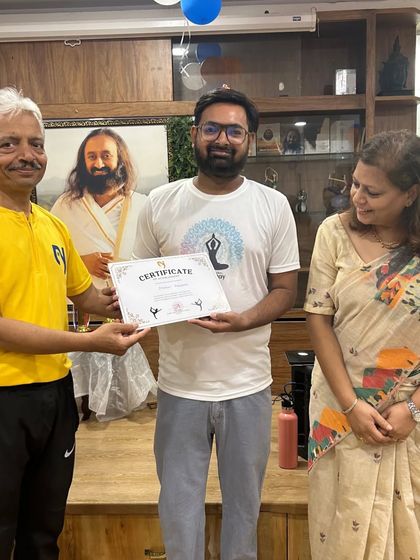 Another dedicated "Early Riser" receives his certificate. These events are a highlight for our studio family.