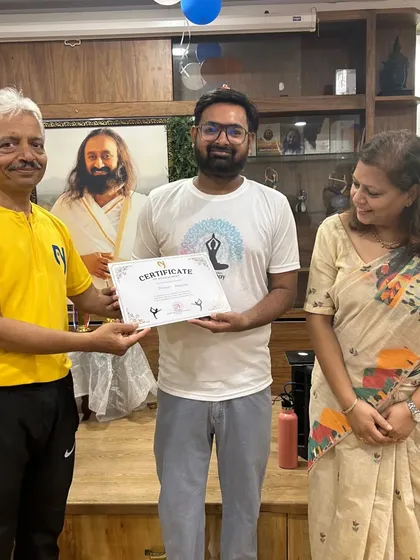 Another dedicated "Early Riser" receives his certificate. These events are a highlight for our studio family.