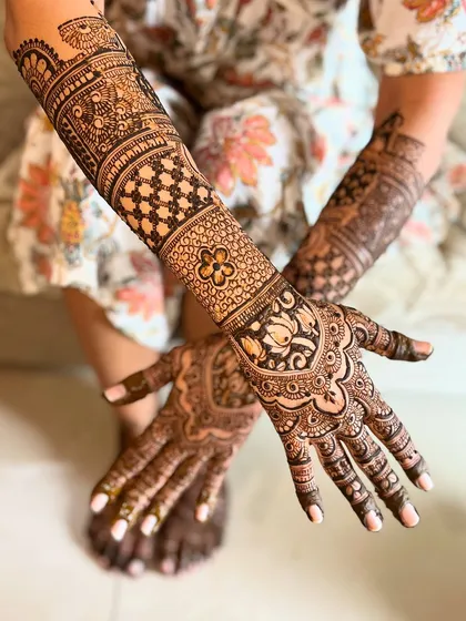 A different angle of the royal heritage design, showing the back of the hands and the continuation of the intricate patterns.