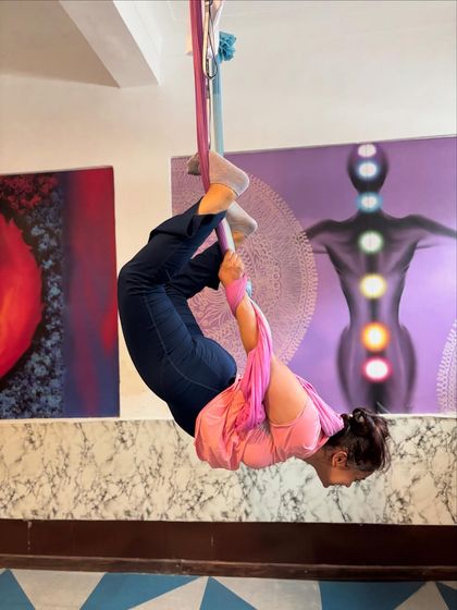 This inverted butterfly pose, or Baddha Konasana, is a wonderful hip opener. The hammock allows you to relax into the stretch while gravity does the work.