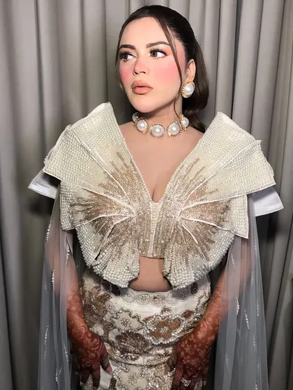 The full look is a masterclass in modern, statement jewelry styling.