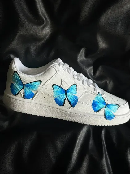 A side profile of the butterfly custom sneaker.