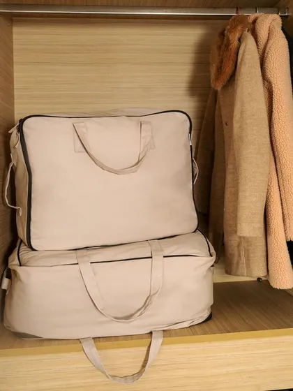Faborange's storage bags placed neatly inside a wardrobe. This image demonstrates the product's practical use for organizing clothes and keeping a closet tidy.