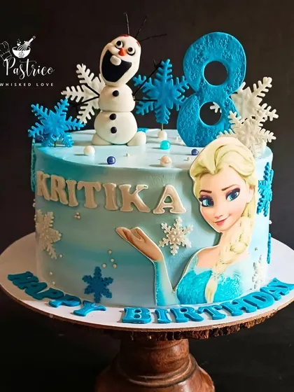 Bringing the magic of Disney's Frozen to life is always a joy. This cake features Elsa and a handcrafted Olaf on a snowy blue landscape, perfect for a fan's birthday celebration.