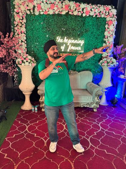 A quick pose at an event after a jam-packed Saturday of playing cricket and DJing a late-night gig. The hustle never stops.