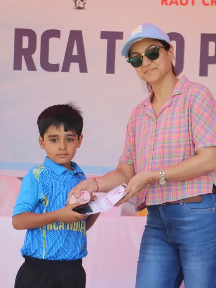 A young player from the RCA Indians team receiving his award.