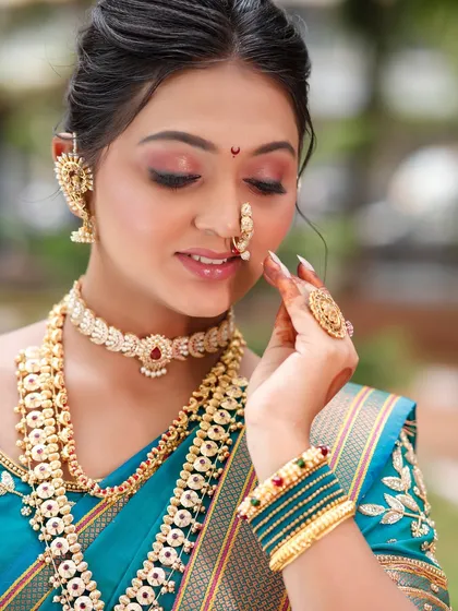 A detailed shot of the eye makeup, showing the delicate blend of colors and the perfectly defined eyeliner.
