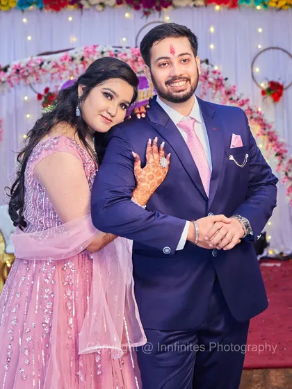 A classic portrait of the couple, with the bride-to-be resting her head on her partner's shoulder. The pose is both elegant and affectionate, perfect for an engagement album.
