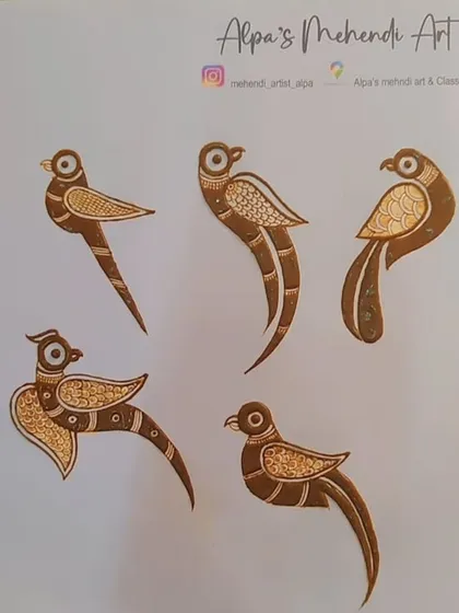We also practice simpler elements like these bird motifs. This helps in understanding symmetry, flow, and how to create smaller filler designs.