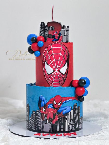 Another angle of our popular two-tiered Spiderman cake, showing the detailed edible prints and vibrant red and blue colors.