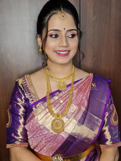 A classic South Indian traditional look for my wonderful client, Aparna. This features beautifully defined eyes, a matching pink lip, and a flawless base that looks perfect with her purple Kanjeevaram saree and temple jewelry.