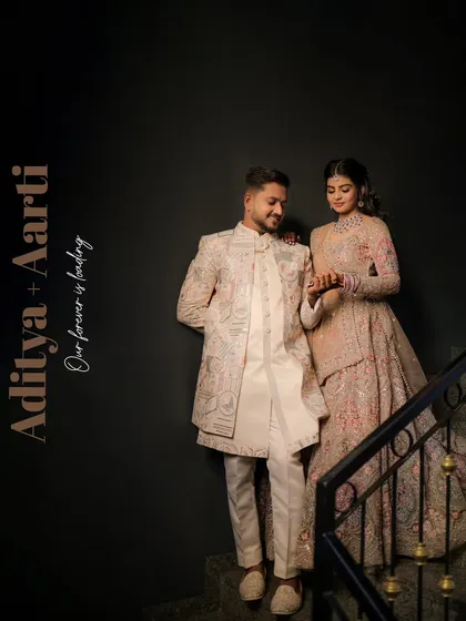 A stylish engagement portrait. We used a dark background and dramatic posing on a staircase to create a modern and sophisticated look for the couple.