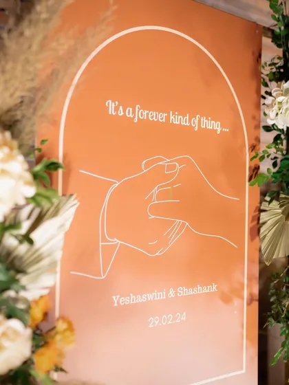 "It's a forever kind of thing." We designed this modern, minimalist welcome sign for Yeshaswini and Shashank, featuring a simple line drawing that beautifully symbolized their decade-long love story.