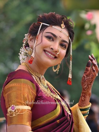 A radiant bride during her wedding ceremony. Her smile is the best accessory, enhanced by a natural makeup look that lets her personality shine.