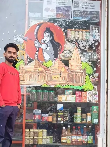 Here I am with the completed Ram Mandir glass painting. It's always a privilege to create art that connects with people's faith and joy.