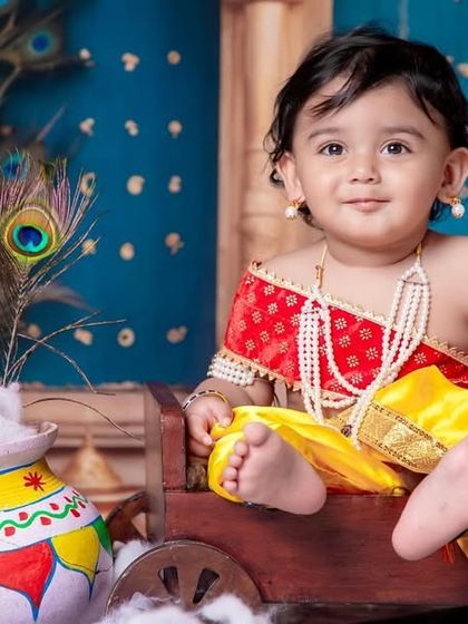 Wrapped in Krishna’s love, shining with divine innocence. The pot of 'butter' is always a favorite prop.