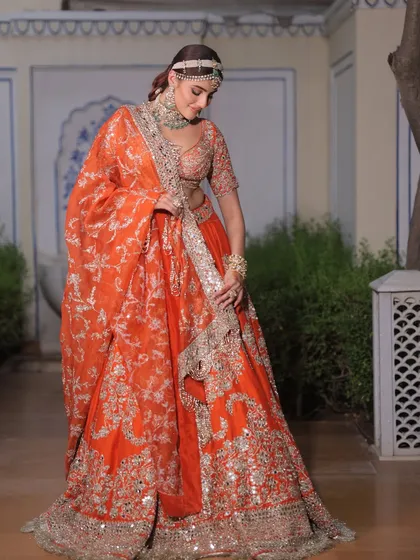 The way the dupatta drapes and flows adds to the grandeur of this Abhinav Mishra creation. I ensure every element of the outfit moves beautifully.