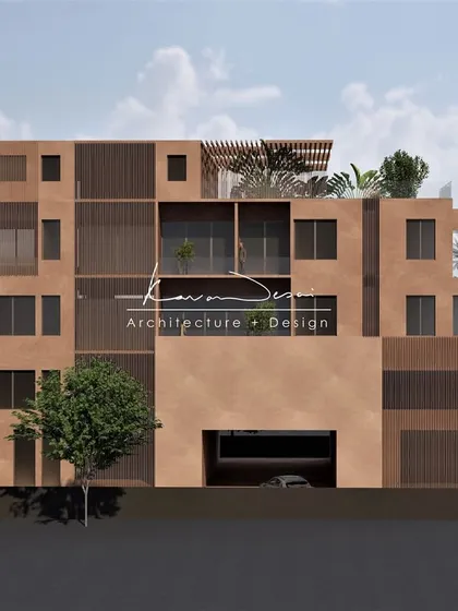A full frontal view showcasing the building's strong, cubic form and asymmetrical window placement. The design plays with solid and void, creating a facade that is interesting from every angle.