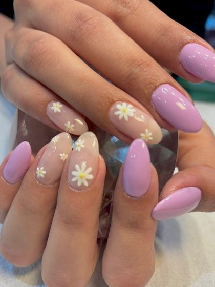Fresh as a daisy. This cheerful summer manicure features a lovely lavender base with accent nails adorned with sweet, hand-painted daisies for a touch of floral fun.