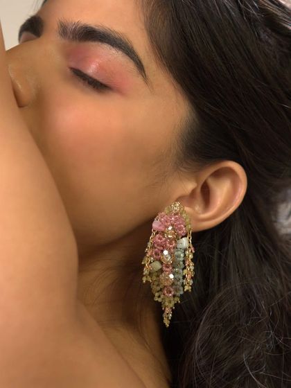 A model shot showcasing how these pastel danglers beautifully complement a soft, romantic makeup look.