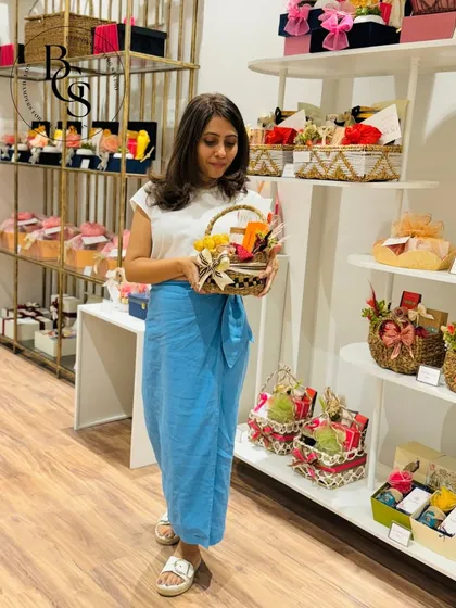 Welcome to our studio! Here I am in our Andheri West showroom, surrounded by a variety of our ready-to-pick hampers. We invite you to stop by and find the perfect last-minute gift.