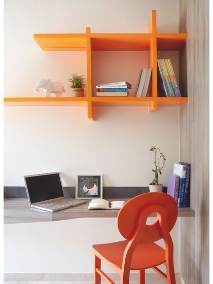 I am on a mission to make study time fun. I designed this study area with a colorful orange bookshelf and matching chair to create an energetic and inspiring space for work or homework.