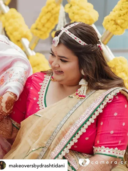 The bride is glowing during her Haldi ceremony. I created a minimal makeup look that would last through the rituals, paired with beautiful floral jewelry.