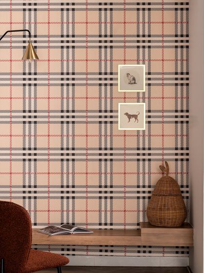 I created this cozy reading niche to break the visual monotony of a long space. The checkered wallpaper adds a classic touch, while the whimsical dog artworks are a little nod to our team's collective love for animals.