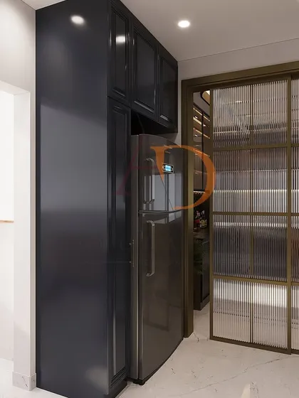 This shot shows the transition from the kitchen to the utility area through a fluted glass sliding door, maintaining a visual connection while separating the spaces.