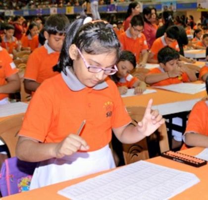 A classroom full of students, each focused on their work. This is a common sight during our state-level competitions, showcasing their incredible discipline.