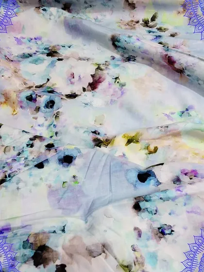 A light and airy cotton fabric with an abstract floral digital print. The soft pastel colors make it a wonderful choice for creating summer outfits.