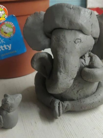 From idol to plant! This image shows the two key components of our Tree Ganesha kit: the natural clay idol and the pot where it will eventually be placed to grow into a plant.