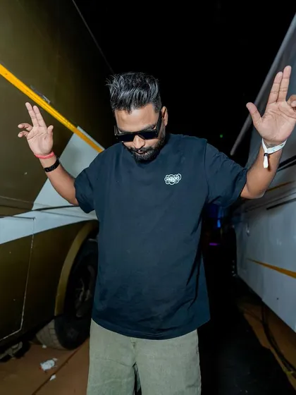Taking a moment between tour buses backstage at a festival. The grind is real, but I'm always ready for the show.