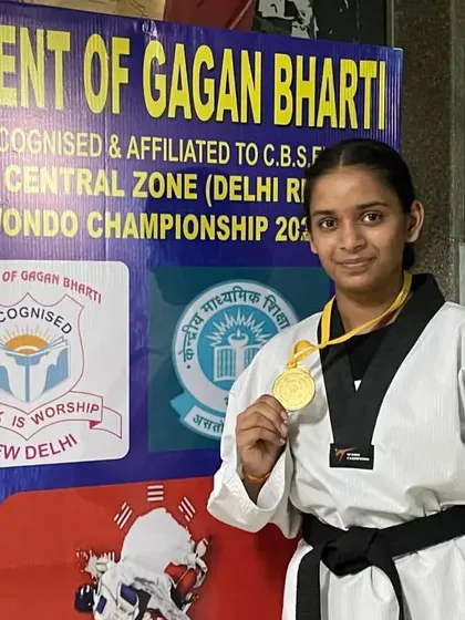 A close-up of our champion, Vanshika Singhal, with her well-deserved gold medal from the CBSE Central Zone Taekwondo Championship.