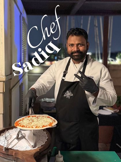 Chef Sadiq at our live pizza station, ready to craft the perfect slice. Our team brings energy and skill to every event.