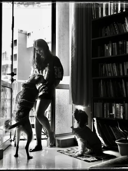 Sara and her dogs, a moment of pure joy and chaos. This 'Doorways' photo is a testament to the love we share with our animal companions.