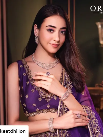 A beautiful shot featuring a rich, purple lehenga. I used complementary tones on the eyes to make the look cohesive and striking, demonstrating my skill in color theory for shoots.
