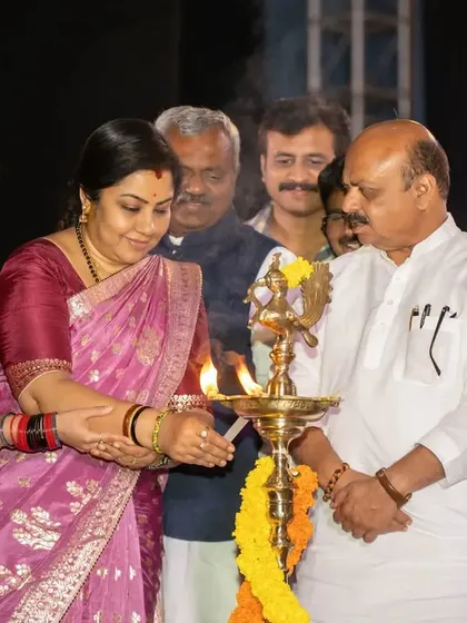 Another angle of the lamp lighting ceremony, showcasing multiple important guests. Our multi-photographer approach ensures we capture all critical viewpoints.