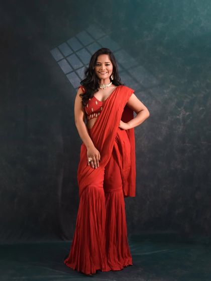 For a more modern take, I styled Sharayu Date in this stunning red pre-draped saree with sharara pants.