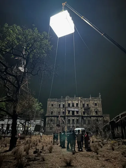 A wide shot showing the scale of the 'Kishkindhapuri' set. Our large, suspended moonbox provided the primary moonlight effect for this entire dilapidated mansion scene.
