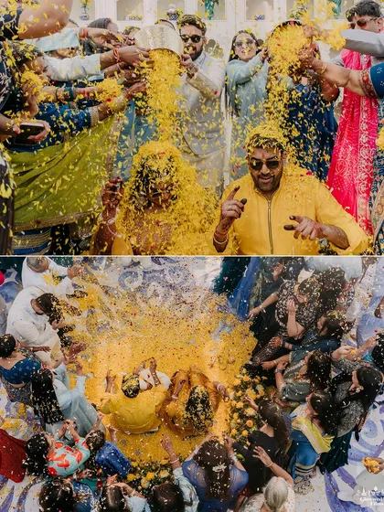 An aerial shot and a close-up of the 'phoolon ki holi', where the couple is showered with marigold petals by their guests.