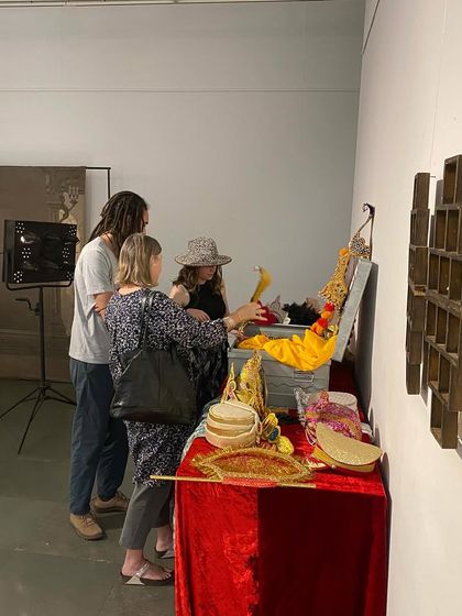 Guests exploring the prop chest during the exhibition.