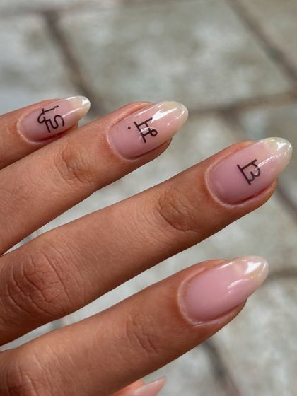 A different angle of the minimalist soap nails with custom lettering.