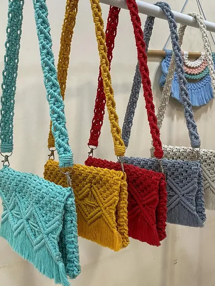 We love playing with color. This shot shows our macrame cross-body bags in just a few of the many shades we offer. You can choose from a wide palette to create a bag that perfectly matches your personal style.