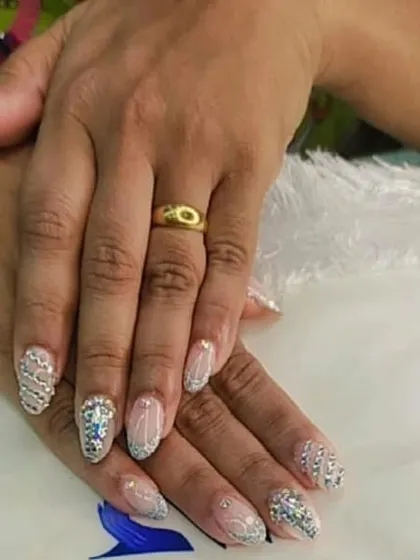 This is the ultimate bridal statement. I meticulously place each crystal and rhinestone to create a dazzling, fully encrusted look on elegant almond-shaped nails, ensuring your hands are ready for every close-up photo on your big day.